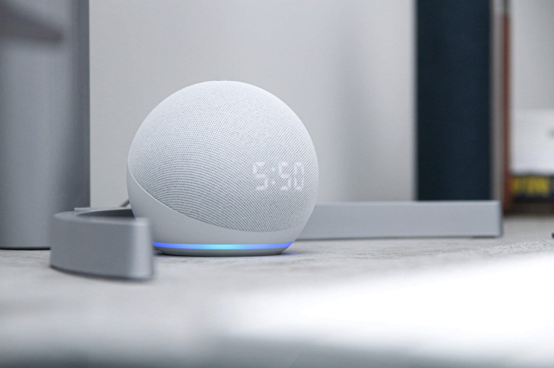 Amazon Echo Dot smart speaker showing the time