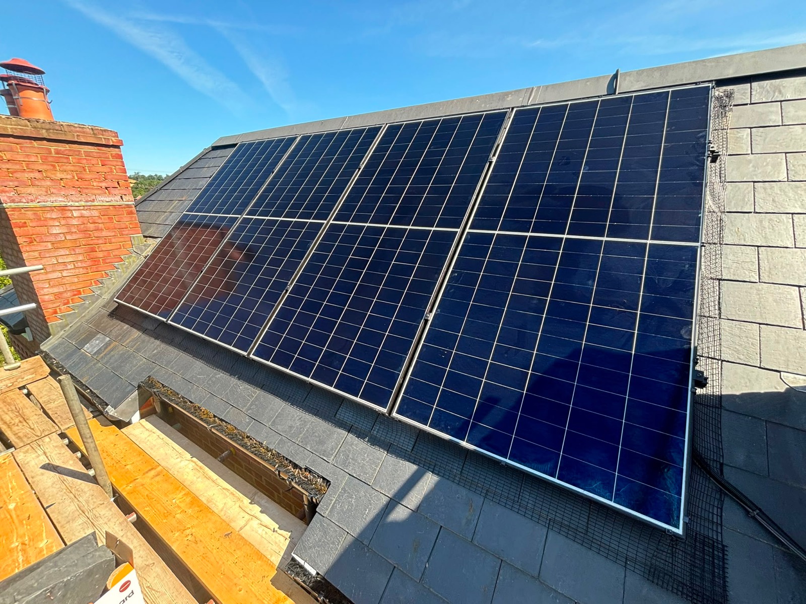Solar panels fitted to a steep slate roof in Botley, Oxford
