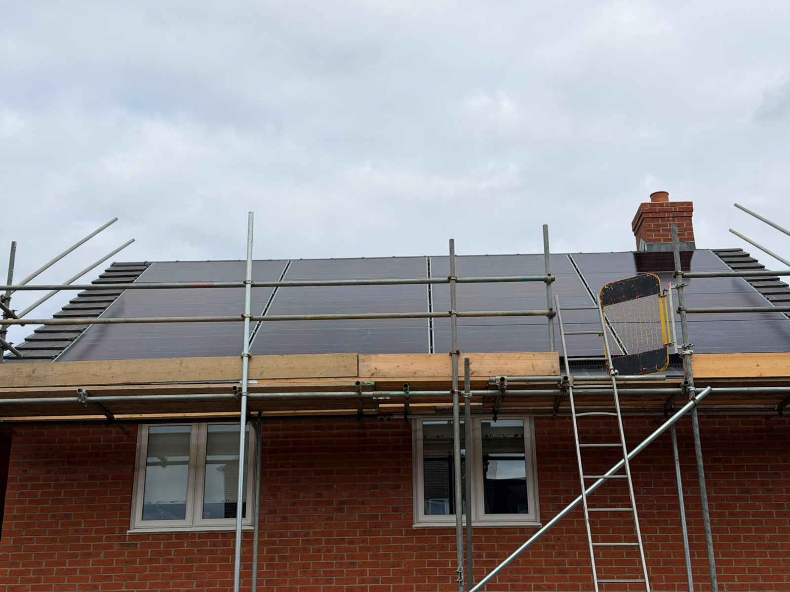 Solar panels on a south-east facing roof with scaffolding still in place