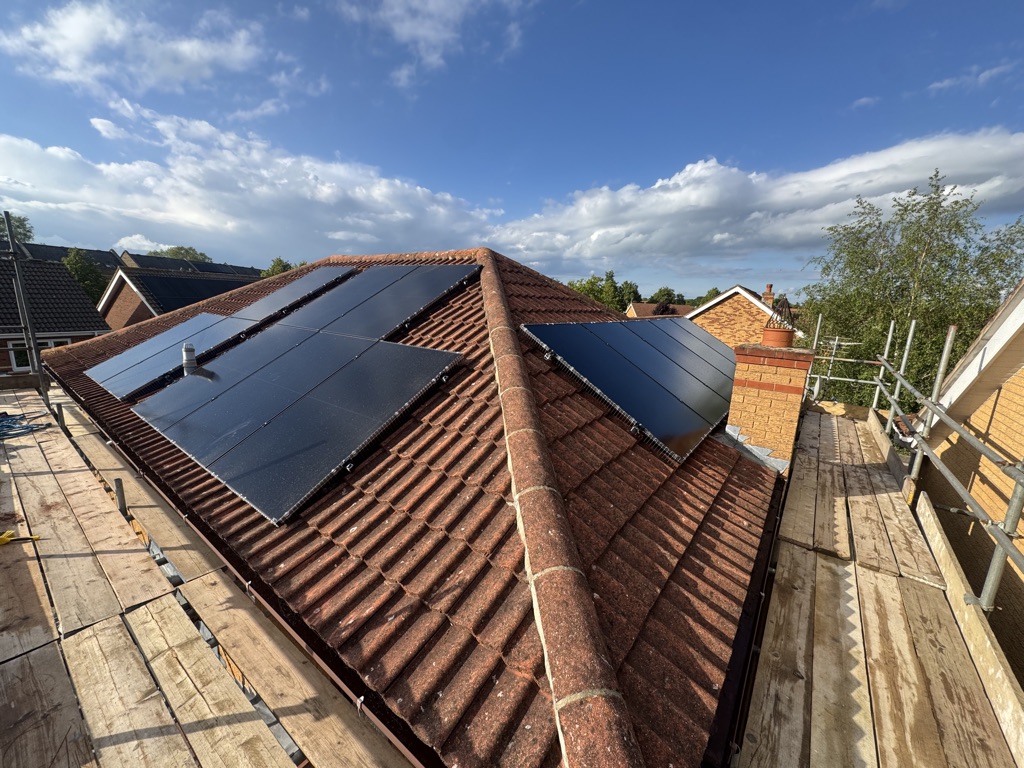 6.045kWp all-black solar panel installation across two roof faces on a tiled roof in Caldecote