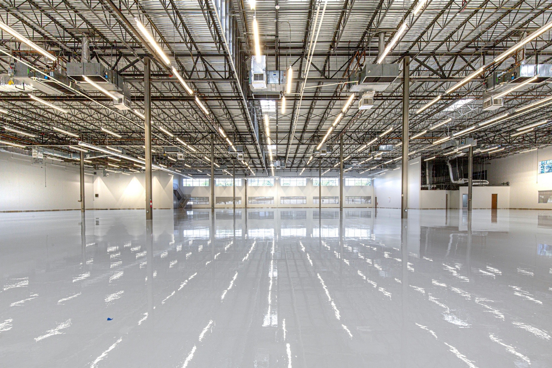 Empty commercial warehouse with bright LED ceiling lighting