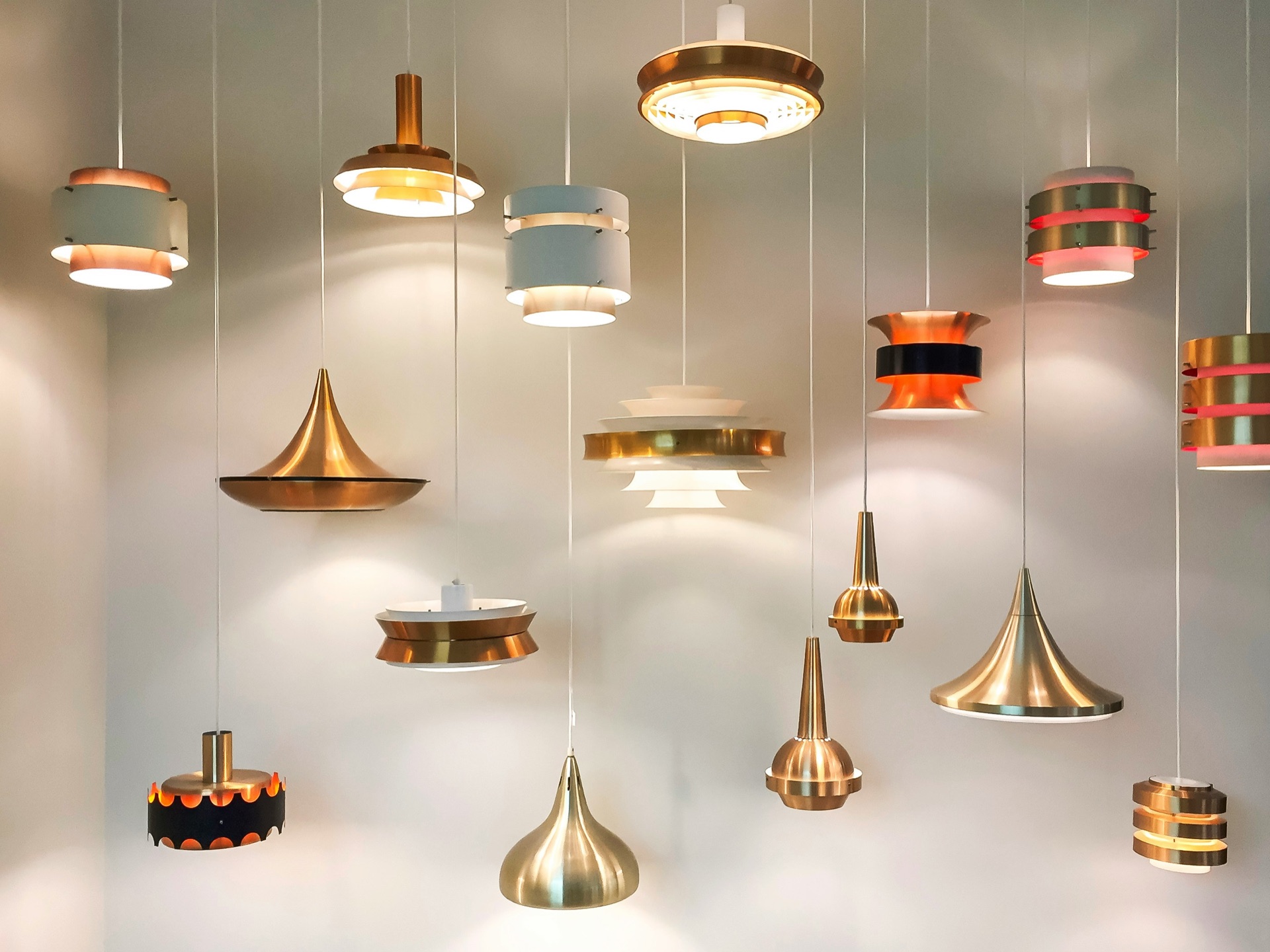 A variety of brass and copper hanging pendant lights