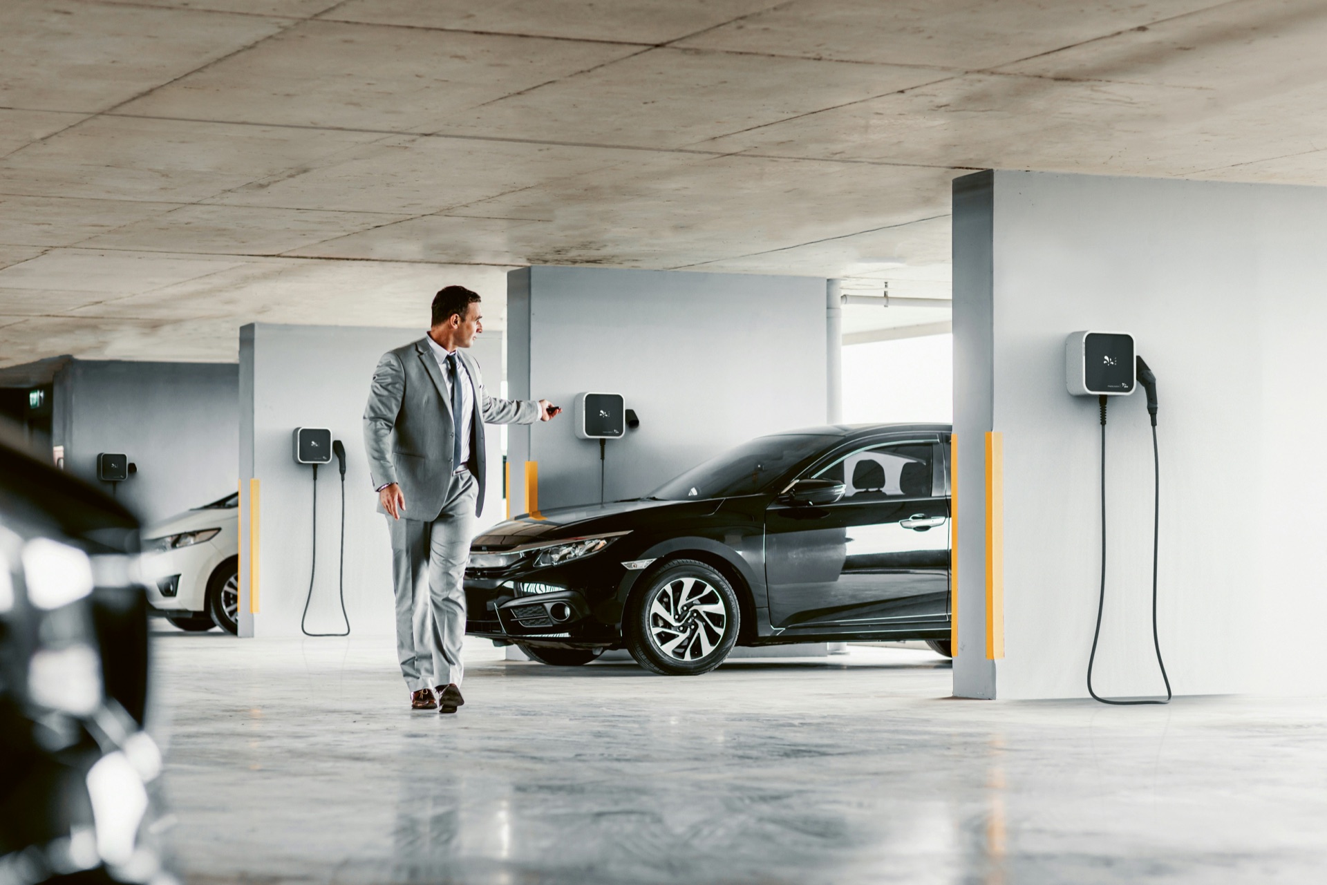 Car park with multiple EV chargers, UK business setting