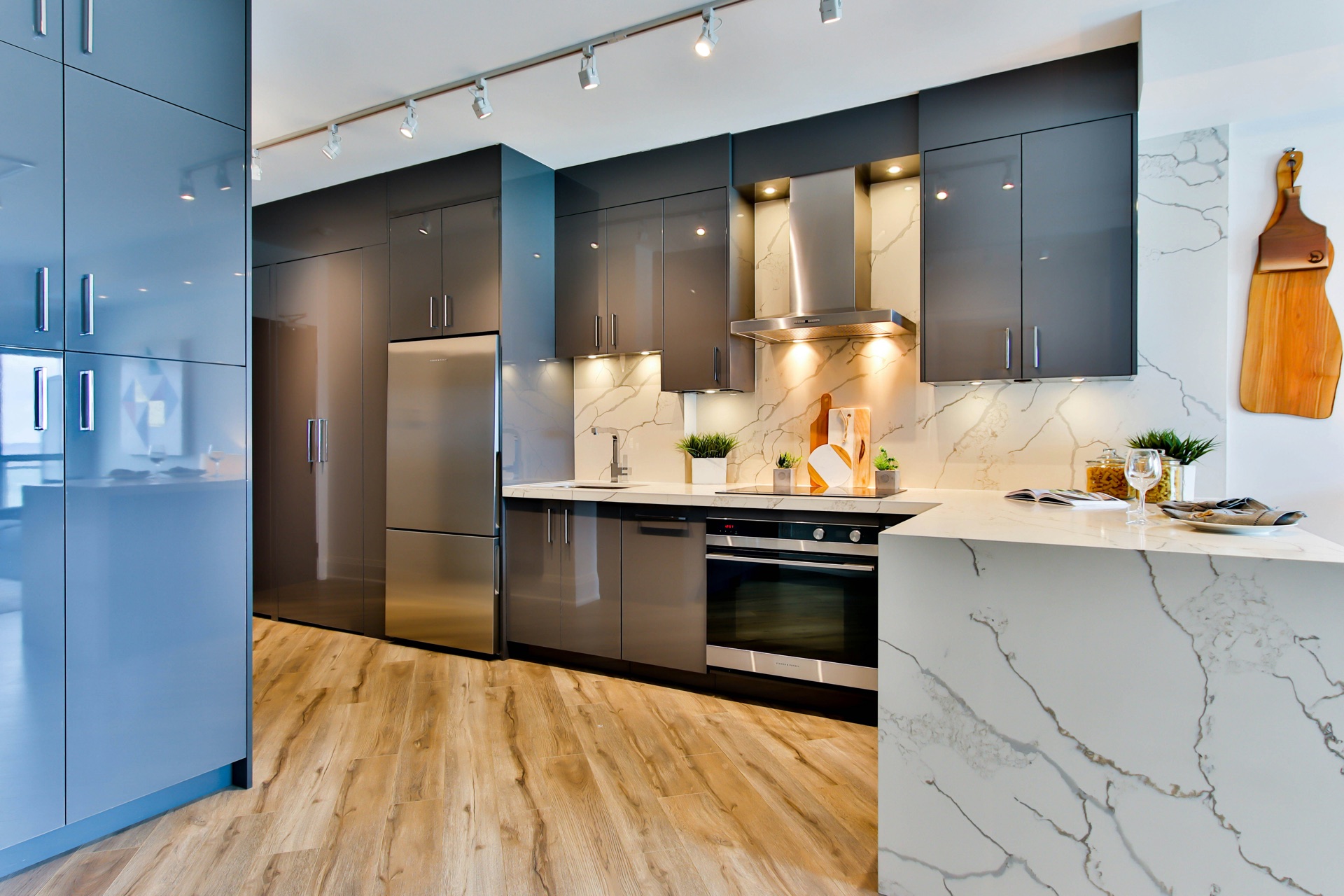 Modern grey kitchen with chrome track lighting